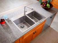 A double kitchen sink can be used to make routine washing easier. In addition, the second compartment can be used to defrost food