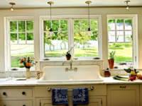 The sink model looks original in the kitchen by the window. This arrangement will allow you to watch children walking in the yard during work.