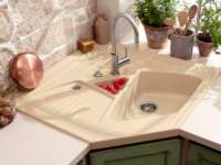 Unusual sink and dryer matches perfectly in color with the surrounding design